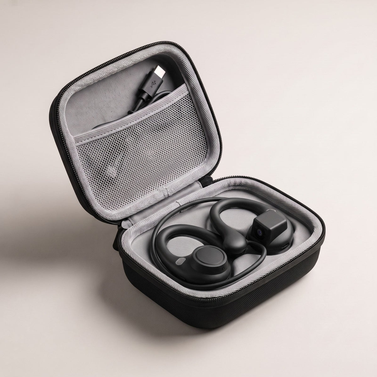 Carry case open with the earphones inside